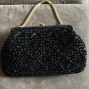 Elegant Black Woven Handbag with Gold Chain